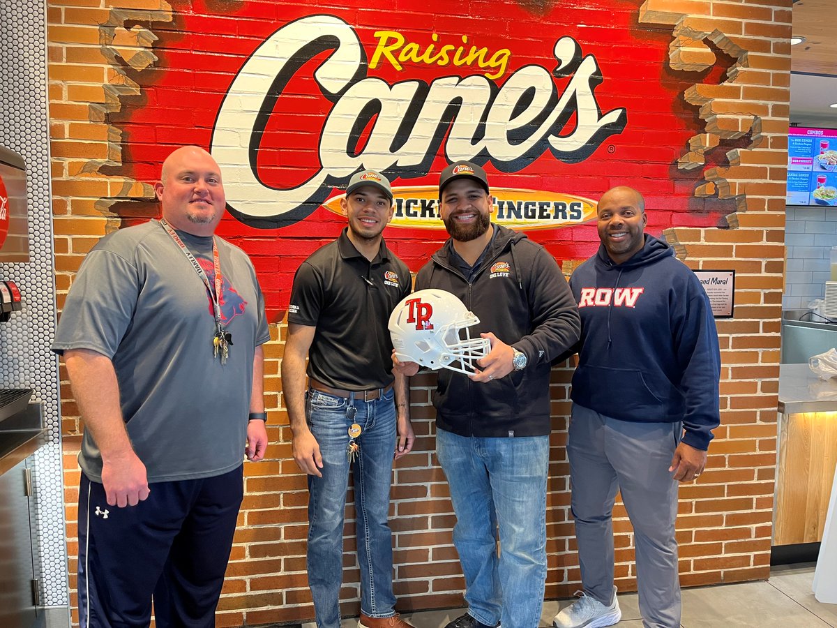 TRRoughRiderFB's tweet photo. Shout out to Cane's Chicken for all they do for the students and athletes @WeAreTRHS! We dropped by for a visit this morning and came bearing a gift, can't wait to see them display their TR Helmet at the new location on Walzem! #TRPride https://t.co/goUVJIPXaX