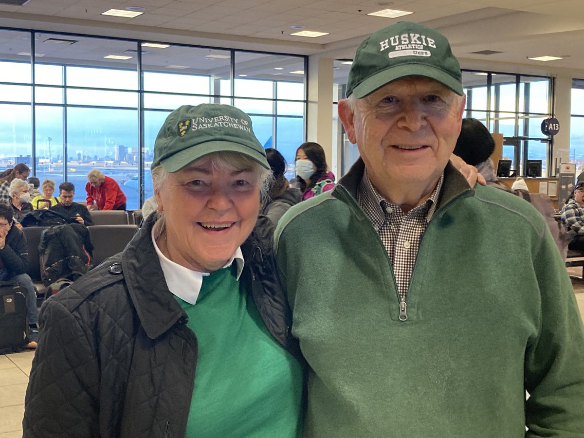 chamelin's tweet photo. Vanier Cup bound! Go Huskies. A great group of parents and our Chancellor Grit McCreath and husband Scott McCreath at YYC enroute to London for the big game! #huskiepride #usask https://t.co/yku99NtDvf