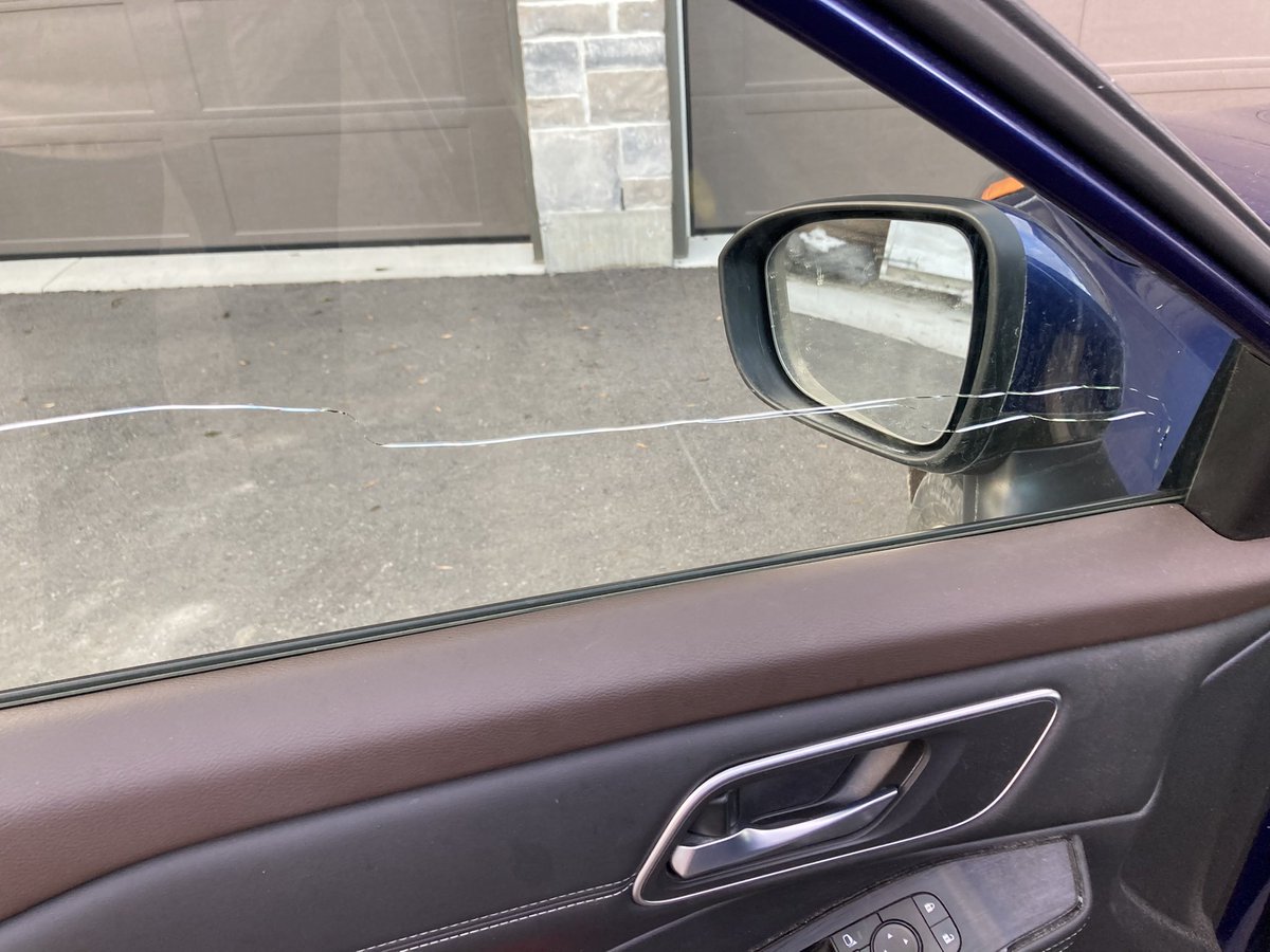 ViewFromACookie's tweet image. I woke up to this: The driver side window in my 2021 Nissan Rogue has a huge crack from the bottom left corner all the way up to the top right. Obviously a product flaw. Nissan won’t do anything to fix it. #Lemon #neverbuyNissan #nothingbutproblems  @nissancanada  @bellenissan