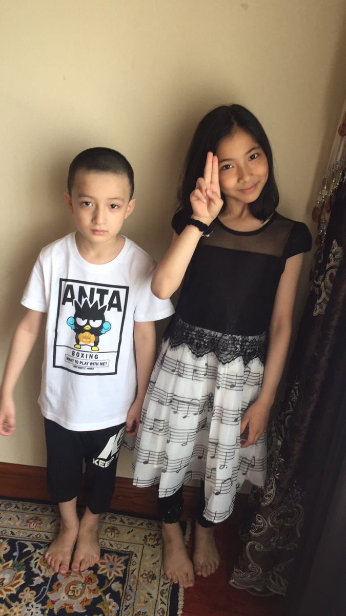 AbduwelA's tweet photo. Uyghur kids died in the fire in Urumqi 24 November 2022. their names Are Nehide and Imran. Nehide is the girl, Imran is the boy next to her..those kids are from 5 to 14. https://t.co/o4a4rKrHzx