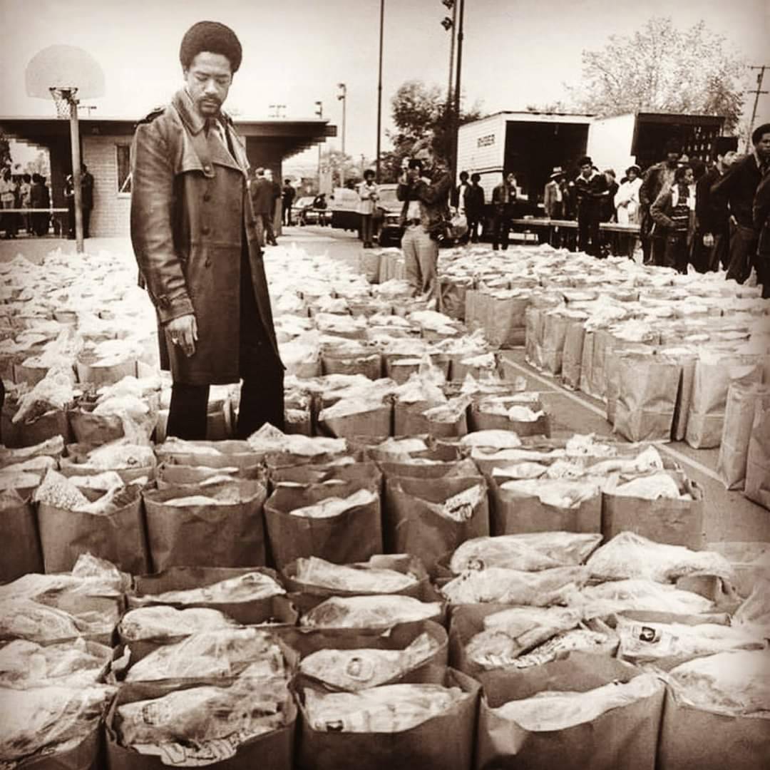 BlkHistStudies's tweet photo. In this photograph, Bobby Seale inspects donations to the People’s Free Food program, which proved a revolutionary initiative focused on the needs of the Black community in Oakland, CA. #dppp #digitalpvpantherproject #bobbyseale #blackpanthers #foodprogram #blackpowermovement https://t.co/u04OGI5cKs