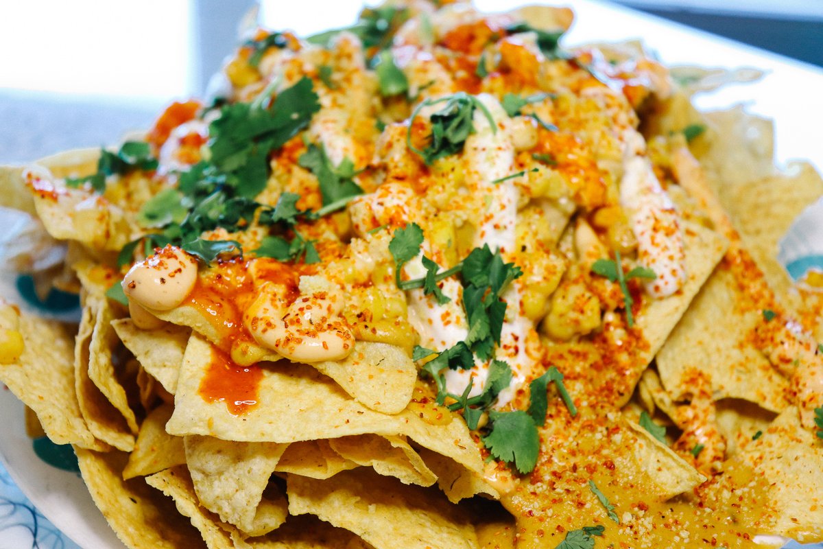 It's chilly outside; come to Spiral and warm up with some

🔥ELOTE NACHOS!🔥 

Made with our original recipe cashew-based nacho cheese and topped with grilled corn, sour cream, chipotle mayo, lime juice, cashew parmesan, cilantro, plus some Cholula and Tajin to warm you up!
