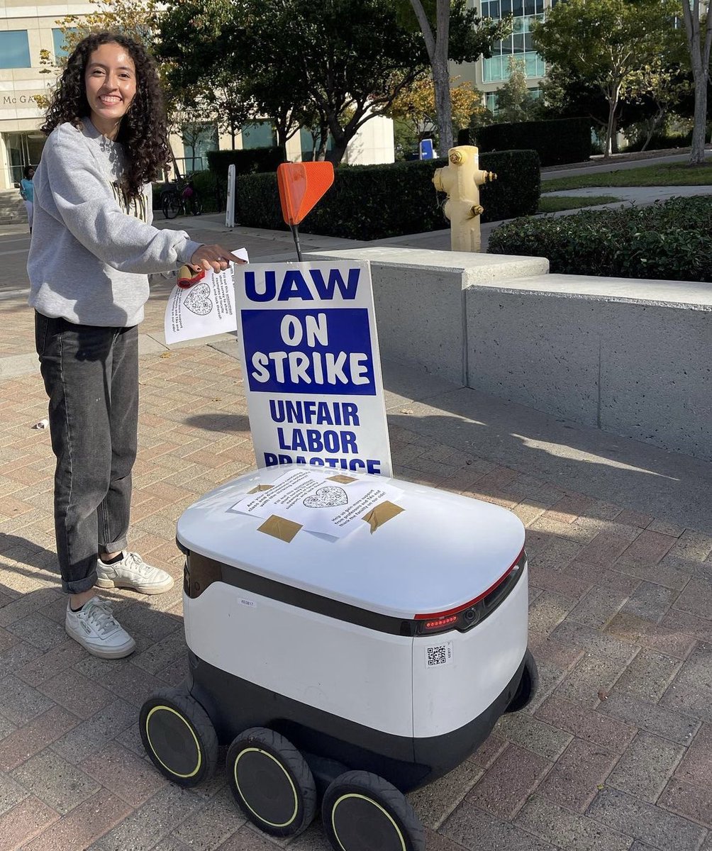 TarronBrump's tweet photo. The comrades of @usimt at UC Irvine have been intervening on the picket lines of the UC academic workers strike since day one. We have had at least two to three comrades there every day from when the picket line opens at 8 to when the picket line closes at 4. https://t.co/IoOvjP38XS