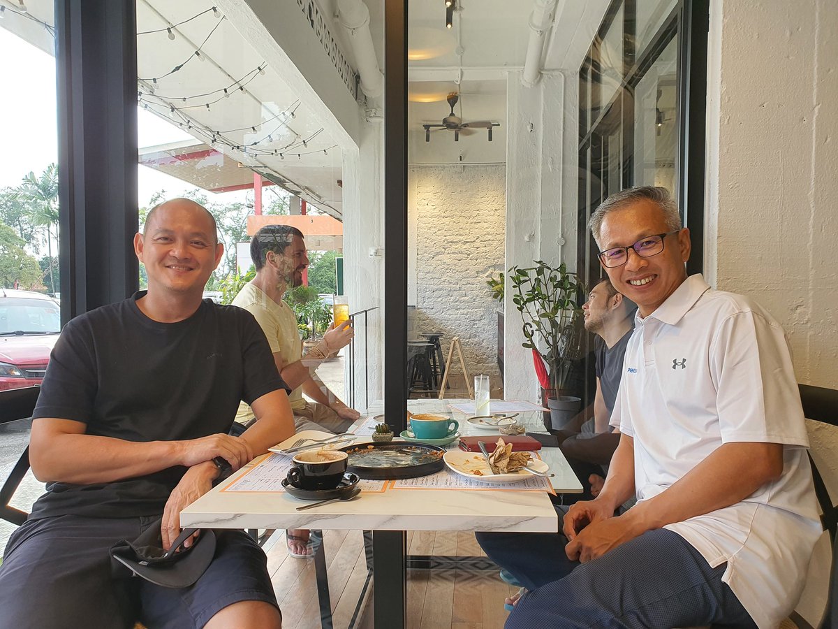 Two unemployed guys sitting in a cafe in PJ...