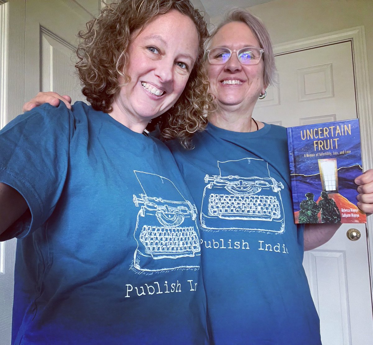 RootstockPub's tweet image. Authors Rebecca and Sallyann @MajoyaWriting in their @IngramSpark T-shirts holding UNCERTAIN FRUIT, which is #2 in Health &amp;amp; Fitness/Fertility &amp;amp; Infertility in Ingram! Proud to #PublishIndie! #ingramsparkauthor