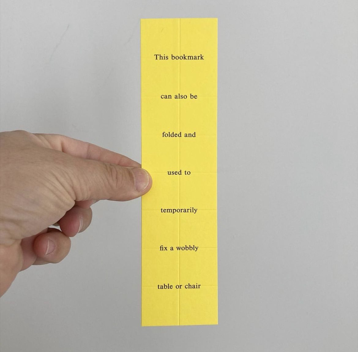 presentcorrect's tweet photo. A bookmark that can be folded to stabilise a wobbly table or chair. 

By Russell Weekes: 
https://t.co/LSL6evqGsw https://t.co/sqWBIy2k3u