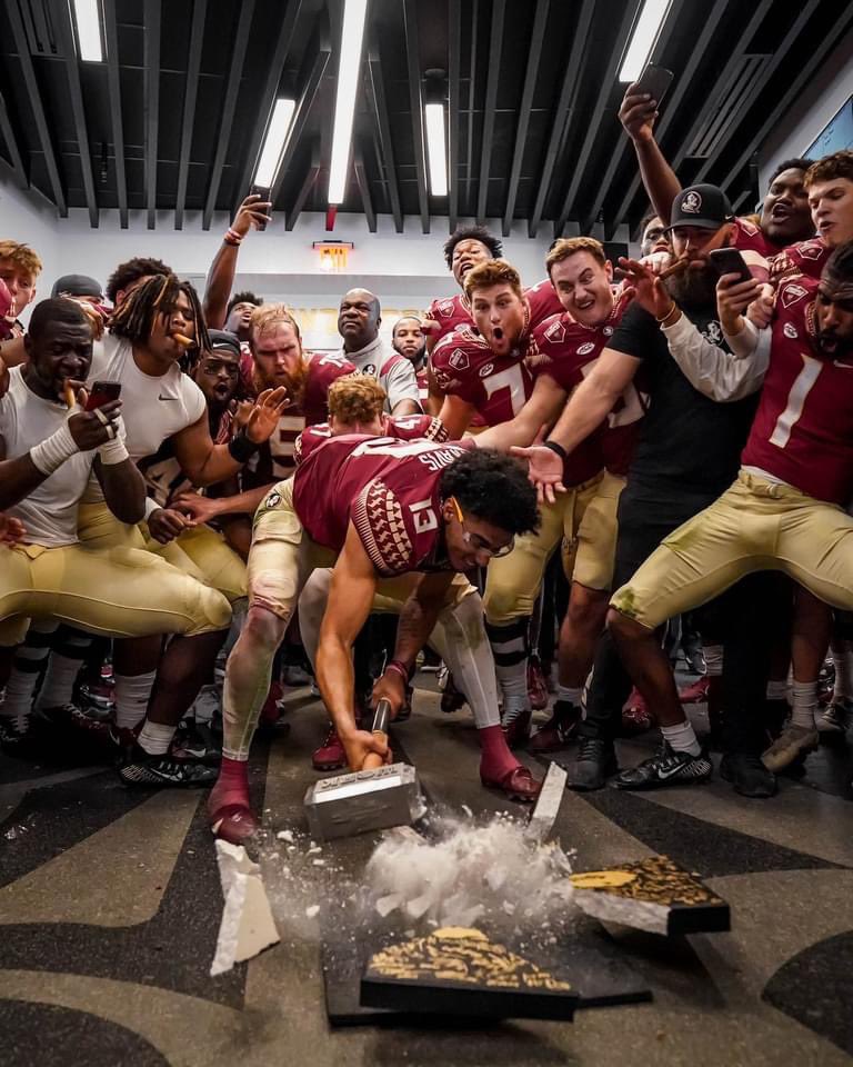 FSUKXAZ's tweet photo. Head Coach Mike Norvell, Strength Coach Josh Storms, and QB Jordan Travis each got to break the rock last night! #TheClimb #StillClimbing #KeepClimbing #FSU #Noles #GoNoles #FearTheSpear #FSUFootball #GatorsSuck #FSUvsUF #FSUvsFU https://t.co/hGMzCbBKoe