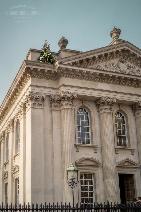 acambridgediary's tweet photo. The Cambridge Night Climbers have been active again - this fully decorated Christmas tree has appeared on a parapet wall of the Senate House.

A picture of Cambridge every day since 2010. (No 4632) Saturday 26th November 2022 https://t.co/6ojiqr15v9