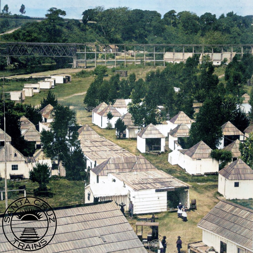 SantaCruzTrains's tweet photo. Summer cabins at Camp Capitola with the Santa Cruz Railroad's bridge over Soquel Creek in the background, ca 1880. Courtesy @capitolamuseum #capitolamuseum Colorized using @MyHeritage #myheritage @DeOldify #deoldify #santacruztrains #californiahistory #santacruzcounty #soqu… https://t.co/JKTy8W9qdC
