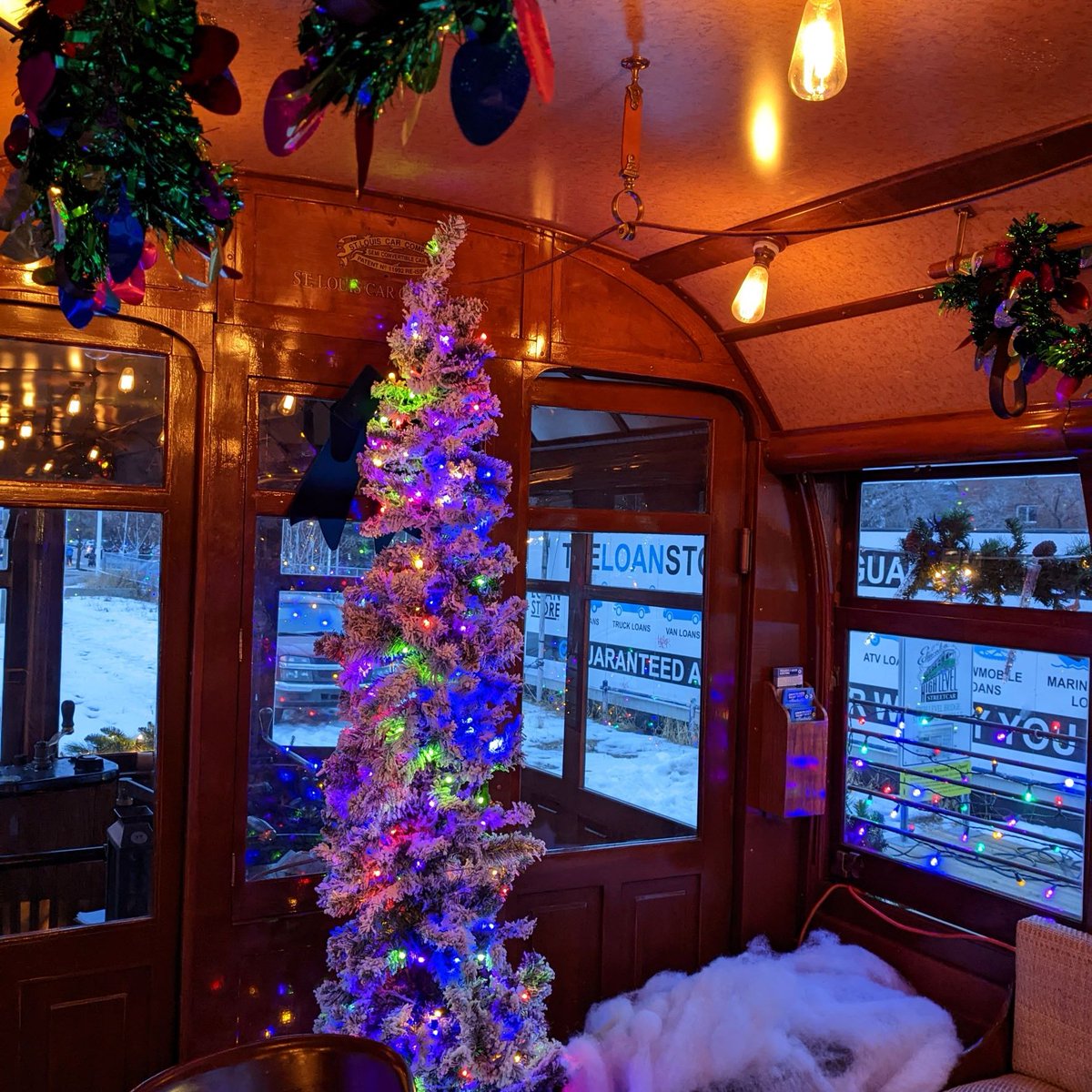 oldstrathcona's tweet photo. The @yegstreetcar folks have done a great job decorating a heritage car for the holidays. There's event a Christmas tree on board! If you miss it at #WinterWhyteLightUp tonight you can still catch the streetcar on Saturdays through December. https://t.co/Z20OYU05SP
