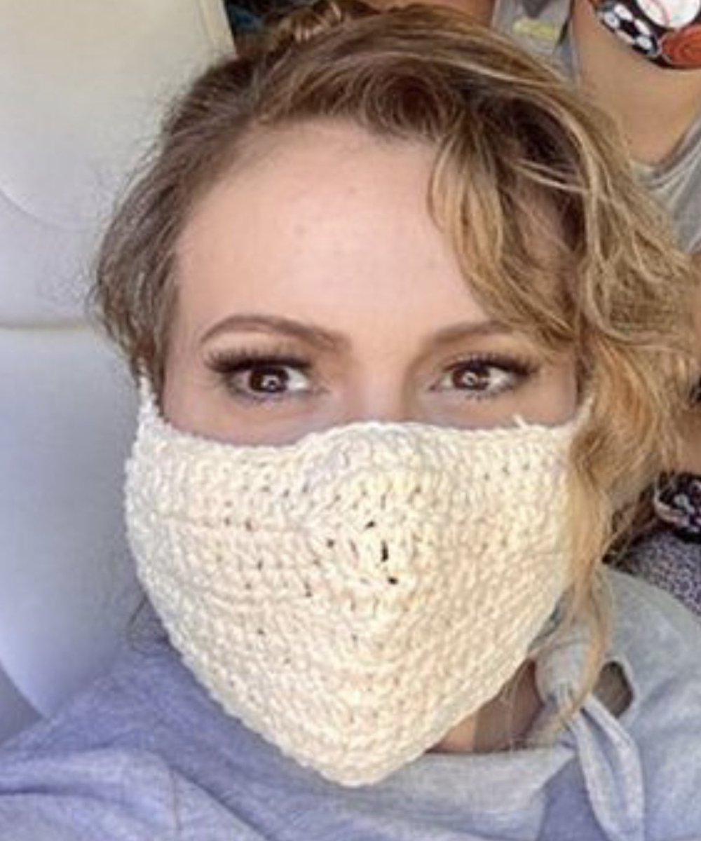The person wearing this crocheted toilet seat cover on her face needs a few history lessons. The science lessons would clearly be a waste of time.