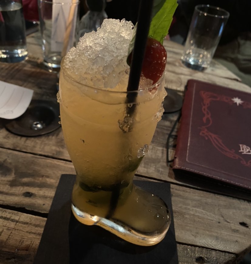 my tom bombadil cocktail is yellow and came in a boot… i love this place
