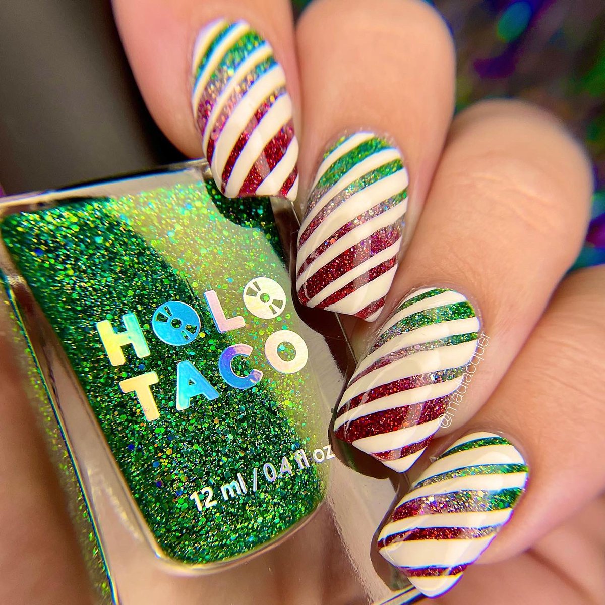 madlacquer's tweet photo. ✨ Picture perfect, shiny family, holiday, peppermint candy! 🎄🍬

Candy cane nail art created using products from @holotaco @nailogical @kbshimmer &amp; @TwinkledT https://t.co/y2dZUOXPzd