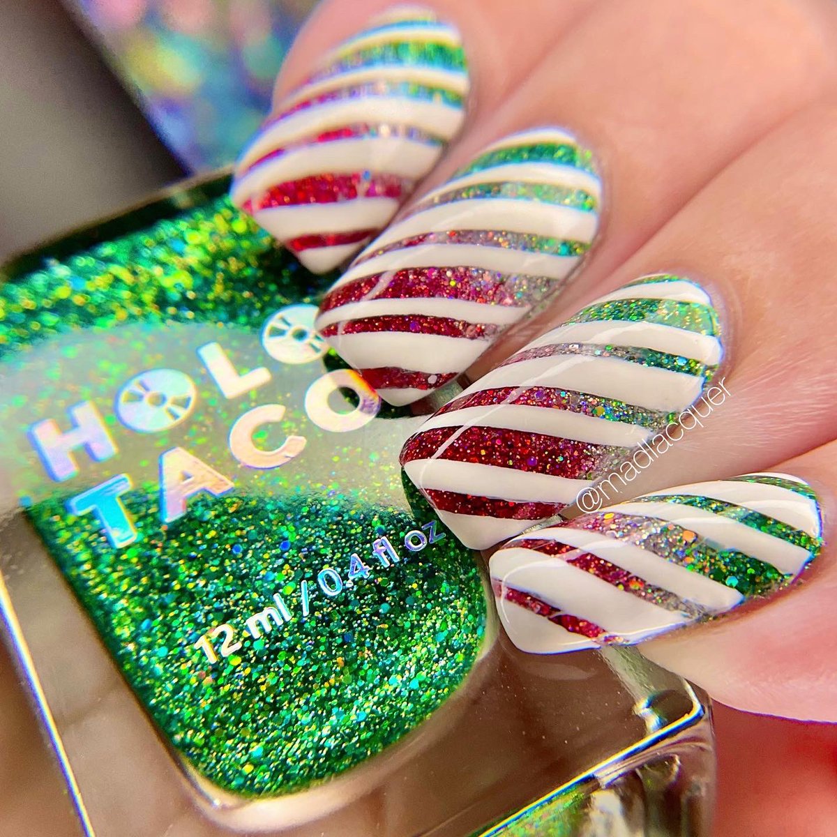 madlacquer's tweet photo. ✨ Picture perfect, shiny family, holiday, peppermint candy! 🎄🍬

Candy cane nail art created using products from @holotaco @nailogical @kbshimmer &amp; @TwinkledT https://t.co/y2dZUOXPzd