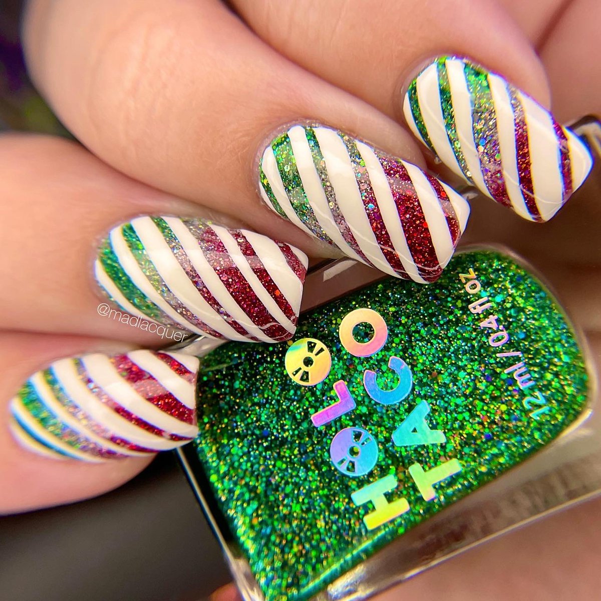 madlacquer's tweet photo. ✨ Picture perfect, shiny family, holiday, peppermint candy! 🎄🍬

Candy cane nail art created using products from @holotaco @nailogical @kbshimmer &amp; @TwinkledT https://t.co/y2dZUOXPzd