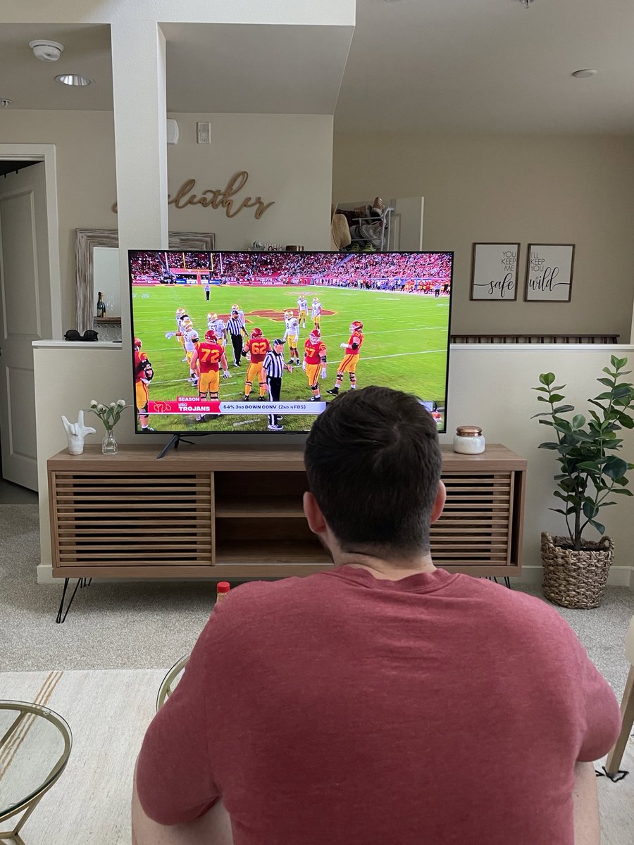 _emgio's tweet photo. joe left me home alone with covid for EIGHT hours so he could go to the usc game. now he’s making me watch that same game on tv. divorce https://t.co/4qGoC9qRGC