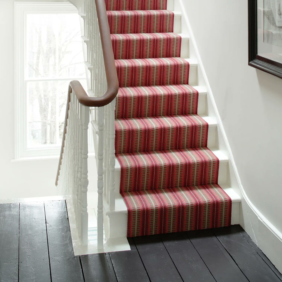 The inviting berry tones of Vernon Soft Red brings colour to this paired back staircase, injecting an element of warmth and texture to the space. Explore our website for more design inspiration - buff.ly/36Eqcs3 

#RogerOates #TheArtofFlatweave