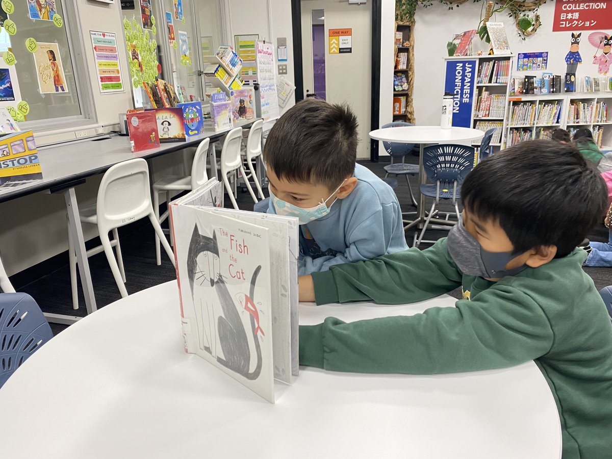 1noisylibrarian's tweet photo. Wordless picture books are a terrific way to build literacy skills! Grade 1 students practice using wordless picture books to create a story with a book buddy @esasij. #asijesshowcase #wordlessbooks #books #communication #cooperation #literacy #storytelling https://t.co/8oHkfxiPNS