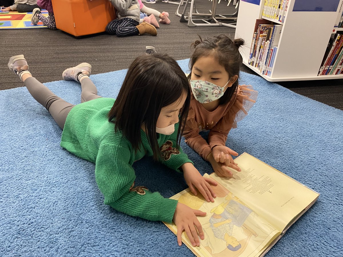 1noisylibrarian's tweet photo. Wordless picture books are a terrific way to build literacy skills! Grade 1 students practice using wordless picture books to create a story with a book buddy @esasij. #asijesshowcase #wordlessbooks #books #communication #cooperation #literacy #storytelling https://t.co/8oHkfxiPNS