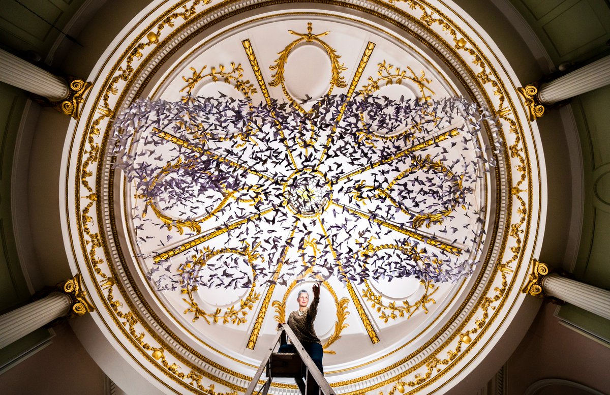 Artist Ails McGee puts the finishing touches to 'Peace on Earth' an installation made of hundreds of origami doves, on display below the ornate domed roof of the 18th-century chapel in the Bar Convent in York.

#BarConvent #ThePhotoHour