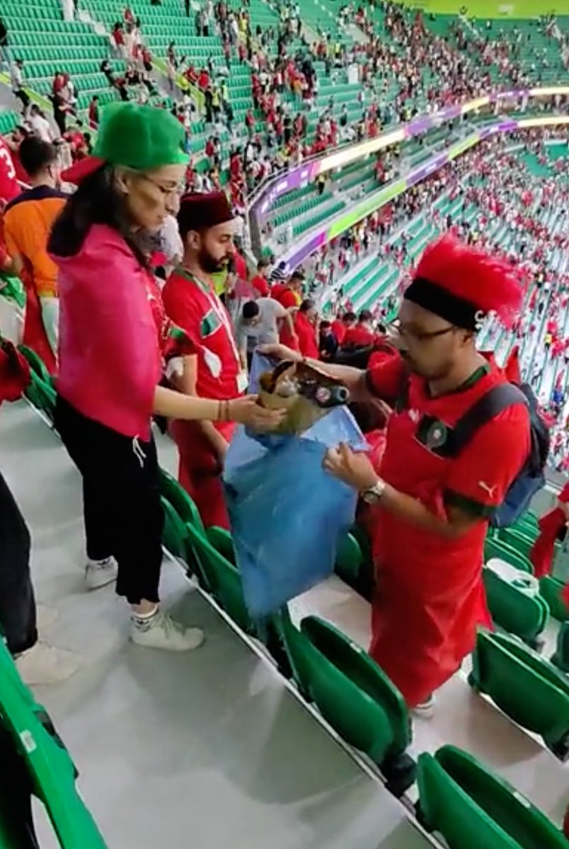 sportbible's tweet photo. Morocco fans stayed behind to clean the stadium after their huge World Cup win over Belgium 🙌

Class ❤️ https://t.co/0okGRn9yyI