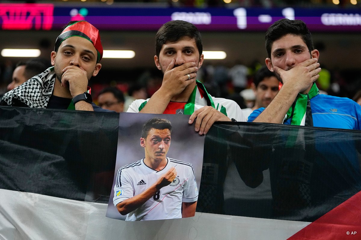 dw_sports's tweet photo. Spectators at Germany's game against Spain mimicked the German national team's protest to highlight the DFB's handling of Mesut Özil's exit from the national team. 

#ESPGER https://t.co/Na6E86F6Zv