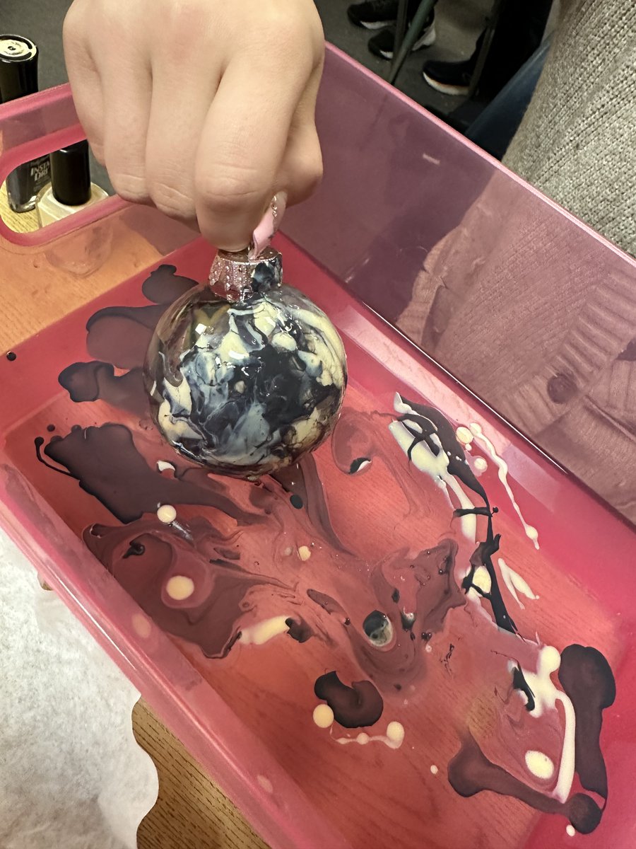 olssac's tweet photo. Our classes continue to create STEM inspired Christmas ornaments to hang on our school's Christmas tree. Pictured here, Ms. Garrett's 7th grade students used a hydro dip technique to create beautifully marbled ornaments, after a discussion on density. #STEMSchool #STEAM https://t.co/YxdlSldxyq