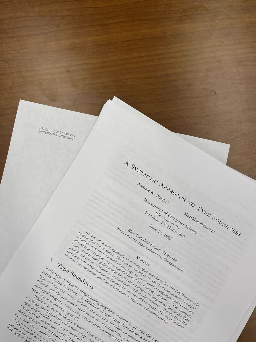 A (partial) printed copy of Wright and Felleisen’s A Syntactic Approach to Type Soundness, followed by an almost-blank page with a printer message, “ERROR: syntax error”