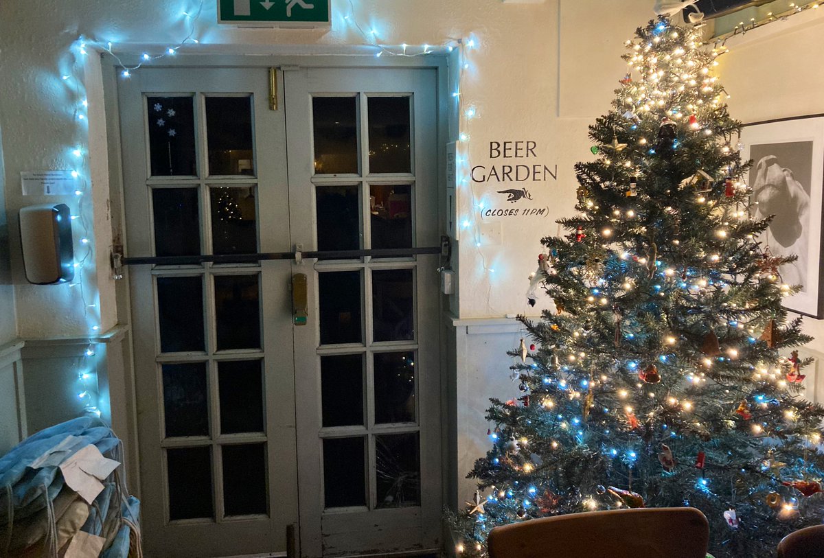 ButchersArmsOX3's tweet photo. While we were out this evening…. under the cover of darkness and the watchful eye of Securicat (tm) @geripubcat, the elves visited and brought Christmas to the Butchers, record-breakingly early for us! #christmaslights #magicelves #elvesinapub #whatcouldgowrong #headington https://t.co/IOO2z6BqkN