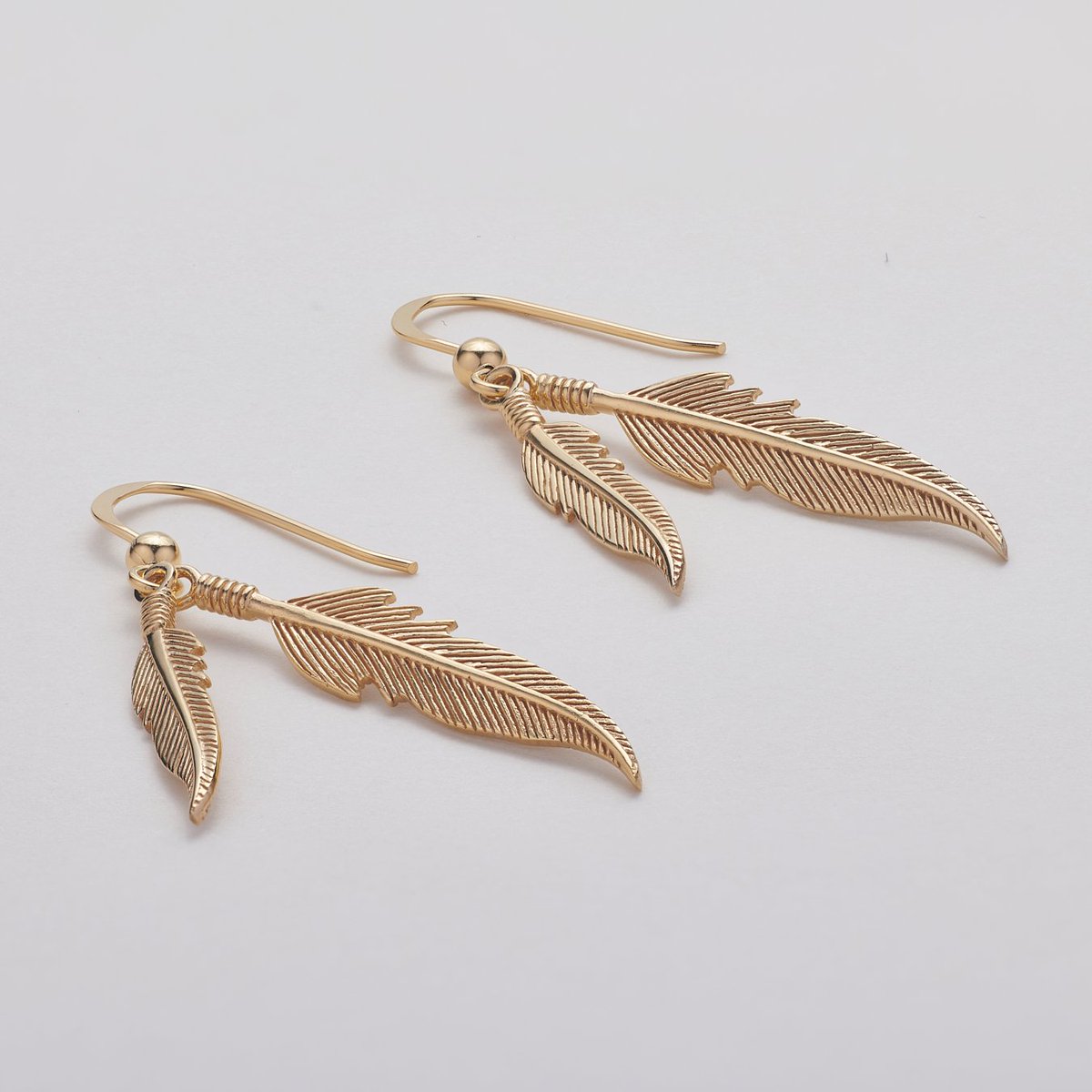 18kt feather earrings by <a href="/FiyahJewellery/">FIYAH Jewellery</a>, also available in stirling silver, rose gold, and 9kt gold.
All our jewellery photography is shot using focus stacking techniques and the best macro lenses to ensure that every last detail is captured on your products.