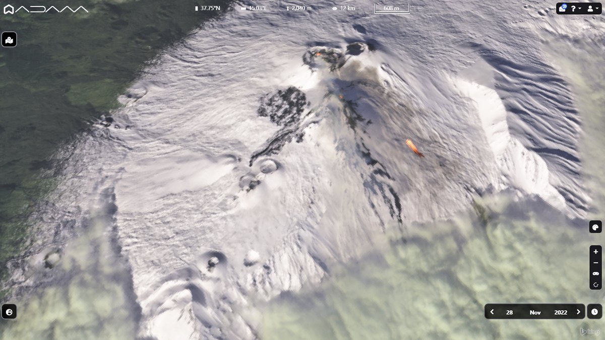 Emerging from the clouds #Etna #volcano wiht the new eruptive fissure. 
The #Copernicus #Sentinel2 image captured on Nov. 28 3D featured with a view from the eastern flank shows hotspots and lava flow.
L'Etna imbiancata mostra la nuova bocca effusiva e una piccola colata lavica.