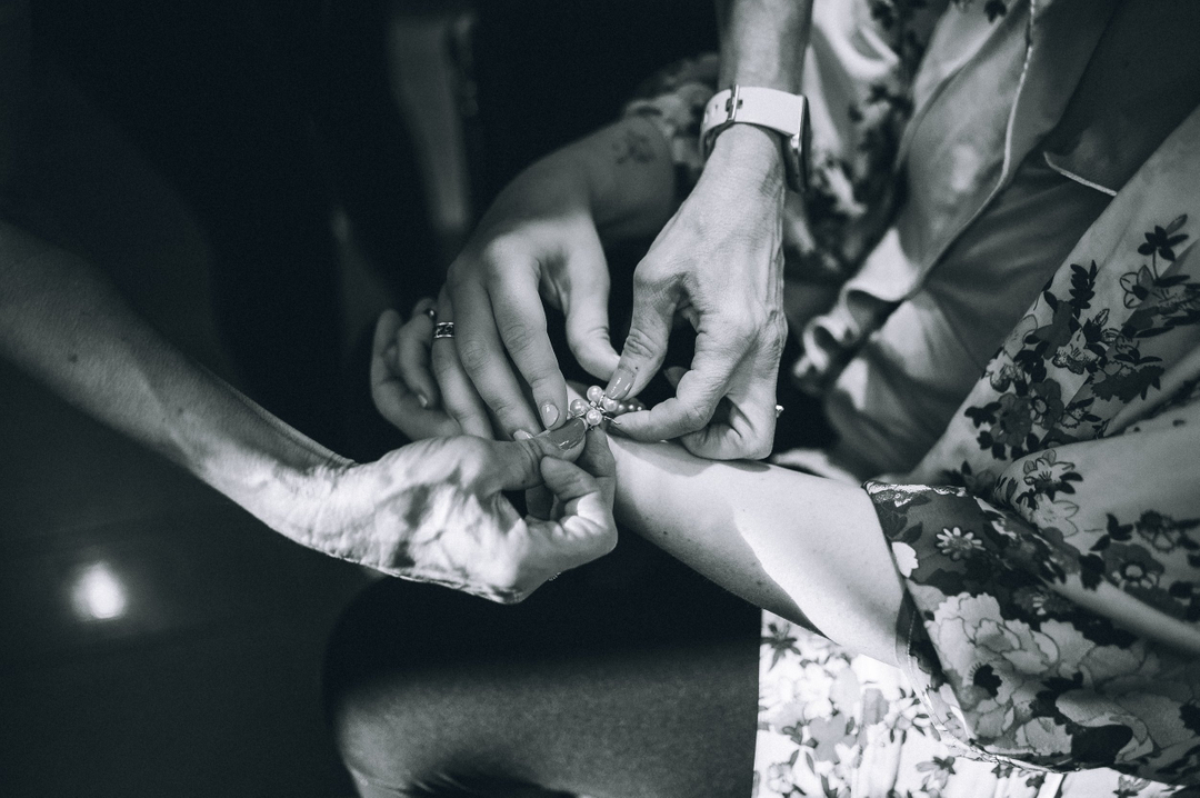 There is something so special about this photo. Two generations of hands, one pair still helping her daughter prepare for one of the biggest days of her life. Motherhood captured, even into adulthood. 

#motherhood #motherdaughter #weddingphoto #weddingphotographer #nashvillewedd