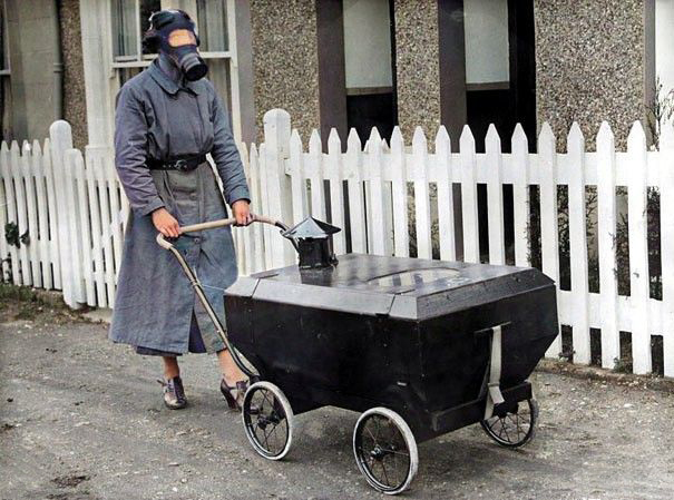 englandincolour's tweet photo. A woman with a gas-resistant pram, in Kent, in 1938. With the threat of war with Germany there was a fear of gas-bearing bombs. #ww2 #bombs #pram #gasbomb #colourised #thirties https://t.co/Y0j8MFhvz2