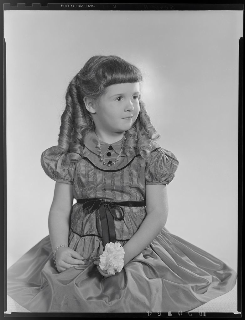 harvard_art_bot's tweet photo. Untitled (portrait of girl with ringlets in dress, seated, holding carnation) - (c. 1955) Paul Gittings | Negative, gelatin silver (film) | 4.2002.12595 https://t.co/rMs8FpM1Dd