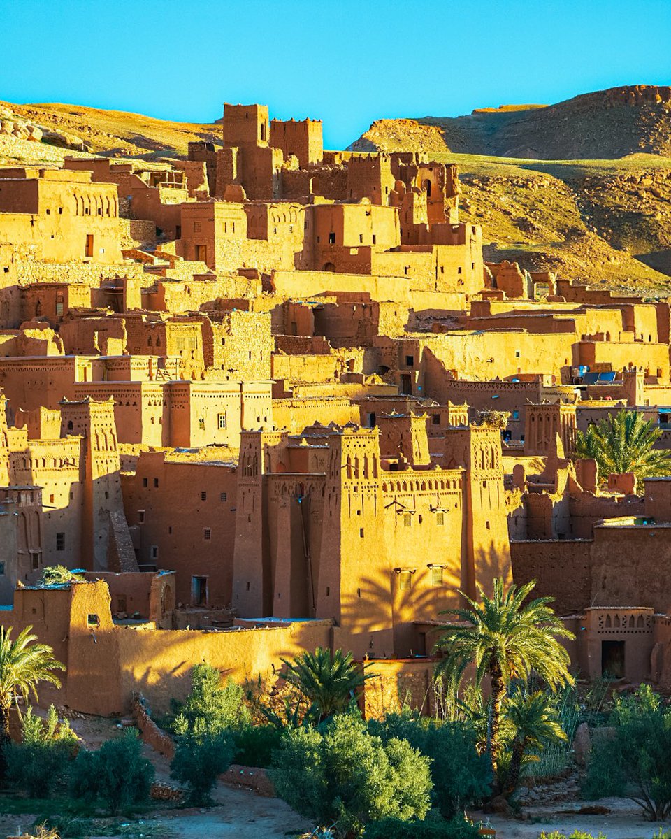 Morocco_getaway's tweet photo. The Kasbah Ait Ben Haddou among the scores of kasbahs to be found in the south of #Morocco is located 30 kilometres from #Ouarzazate. On the edge of the desert, the adobe-built houses of Ait Ben Haddou’s impressive ksar stand at the foot of a cliff https://t.co/eZ6G0k3Id9