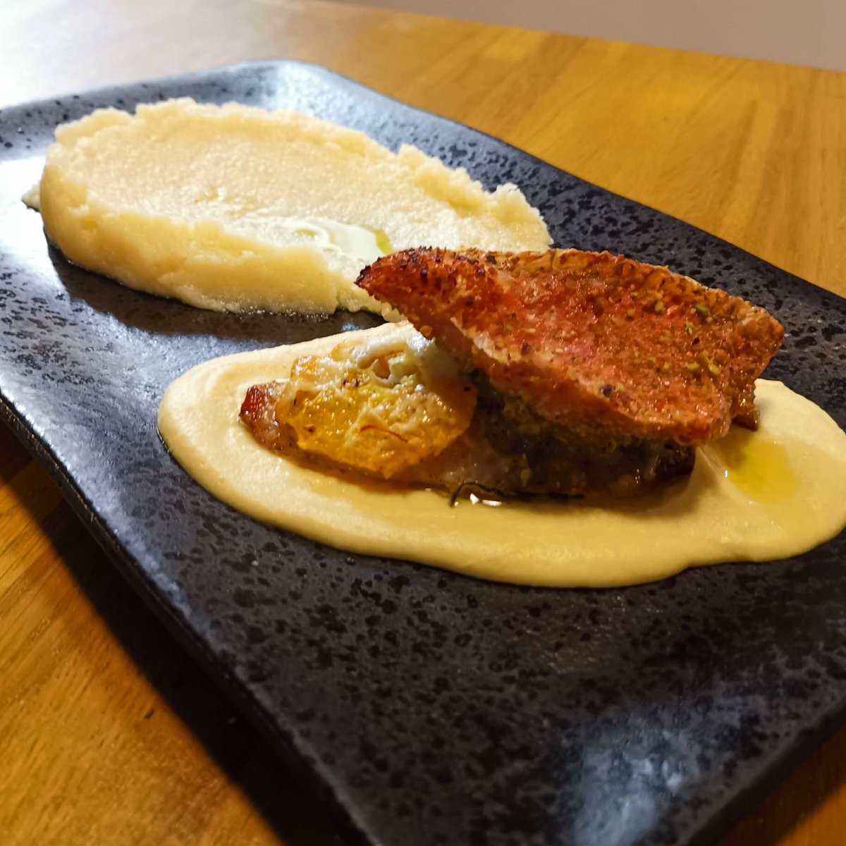 Pistachio-crusted red mallet, chickpea cream, orange & pecorino romano, with celeriac mash.

#weeklyspecials #comfortfood #tasteoftheseason #eatlocal #eatitalian #italianflavours #londonrestaurants #eastlondonfoodie #leytonstonefood #moraitalianrestaurant #lovelocal #tastelondon