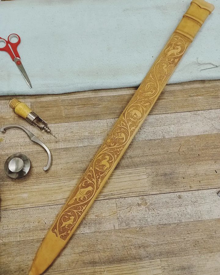 making a new #sword scabbard and this one is full of tiny critters fluttering around :D