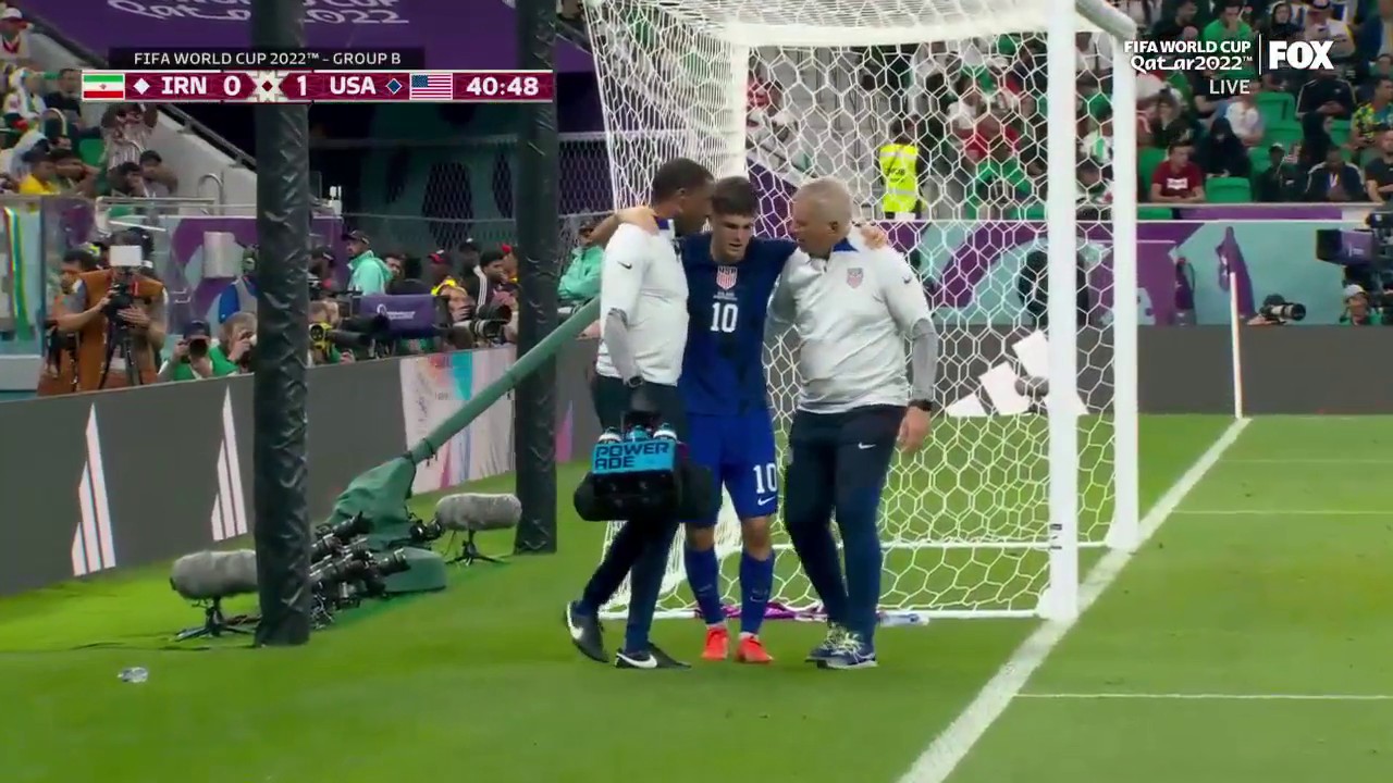 Pulisic is helped off the sideline after scoring for the USMNT”