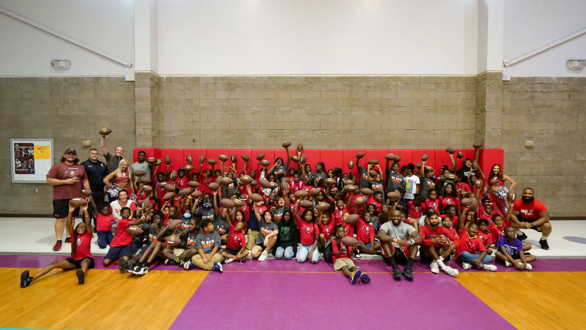 SportsTampaBay's tweet photo. No better day than #GivingTuesday to relive our 2nd #Forever55 Football Clinic, as kids from East Tampa received footballs &amp; shirts from @Fanatics and football drills from the @Buccaneers as Replay Tampa Bay continues to Help Keep Kids in the Game!

WATCH: https://t.co/UTiGTDlldV https://t.co/ibFtgekO7L