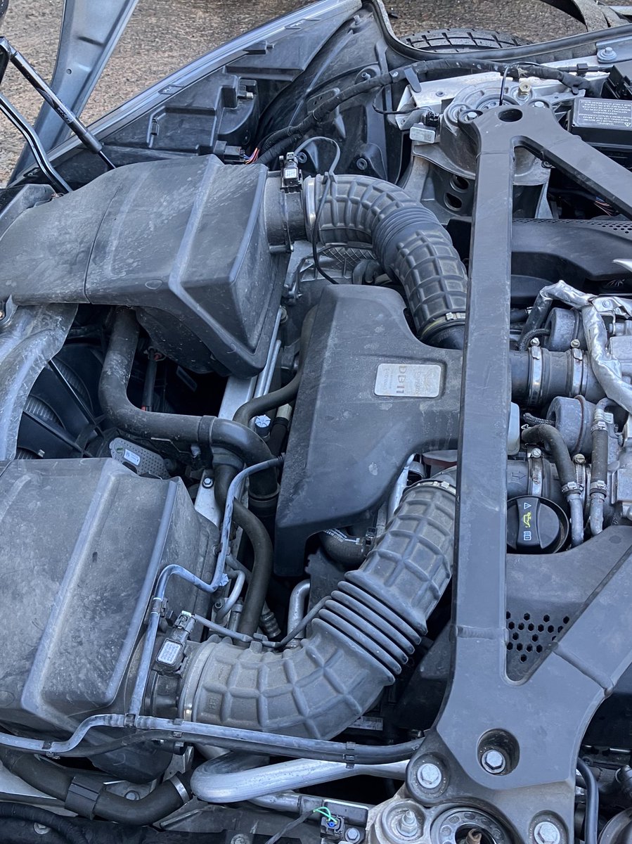 It’s an awful big bonnet! 
Considering how far back the engine is in the engine bay, a lot of design and aero make it what it is. The front hinge mechanism is fabulous engineering!