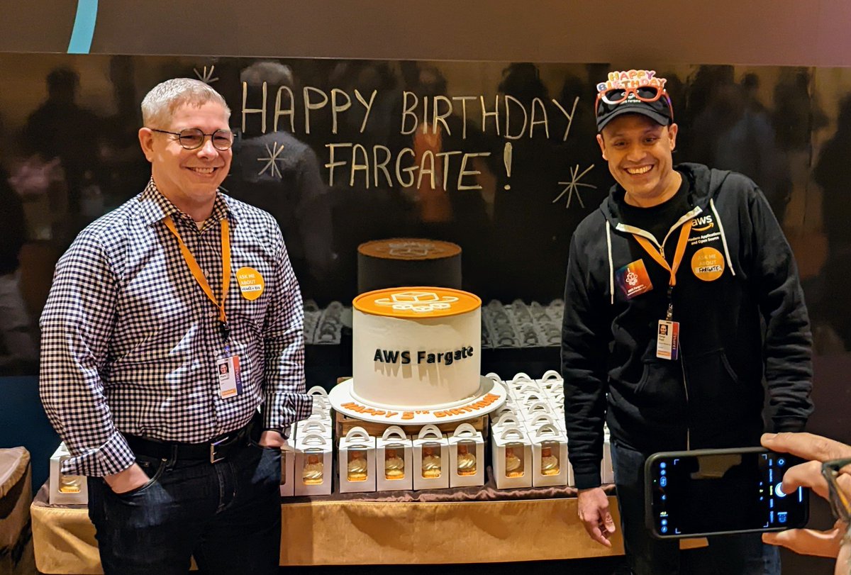 Check out <a href="/omieomye/">Omar Paul</a> and <a href="/MatsLanner/">Mats Lannér</a> celebrating AWS #Fargate turning 5 today at #reInvent
Grab a cupcake at the Modern Application Zone in the Venetian on Level 3 (one escalator up).
P.S. caught <a href="/mndoci/">Deepak Singh</a> hand in the corner 🤣
