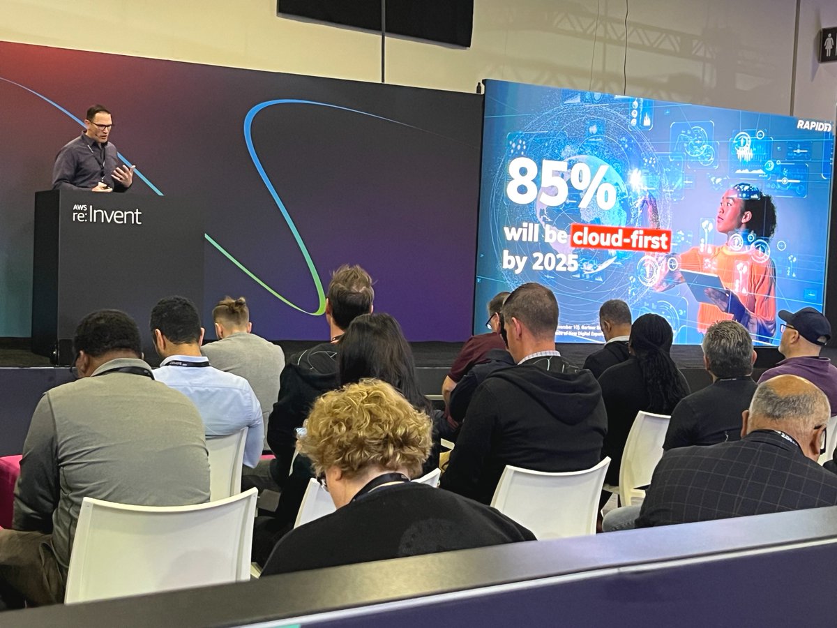 rapid7's tweet photo. "Over the next 4 years, 85% of organizations will be #cloud-first." – Live @AWSreInvent, Rapid7 expert James Green discusses this topic and more during a lightning session on strengthening threat detection &amp; response ⚡️☁️

(Similar topic in today's blog: https://t.co/TCgJRUlTx2) https://t.co/V1gkoEcIJX