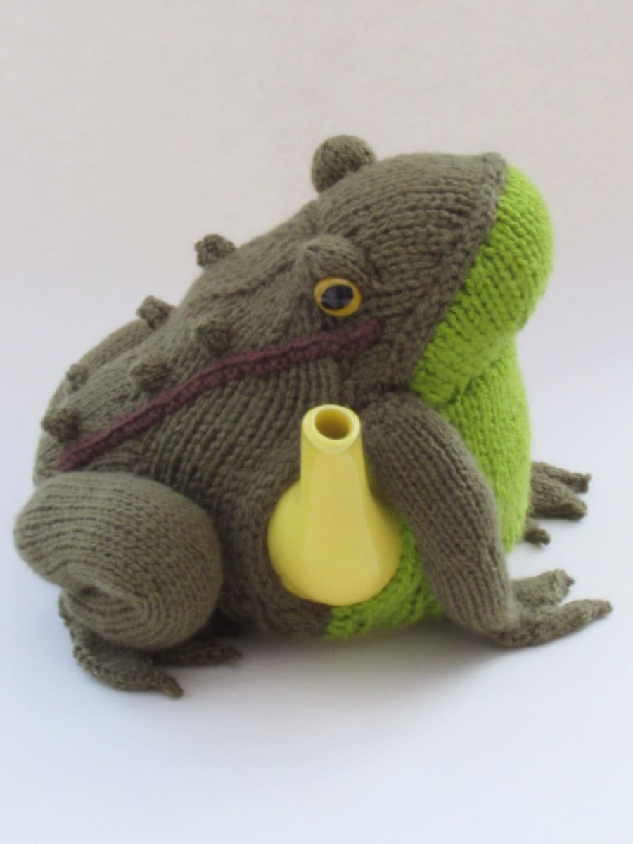 Maybe he'll turn into a handsome prince? Frog Tea Cosy Knitting Pattern etsy.me/3EQNo7W #knitting #animalteacosy #teacosy #knittingpattern #teapotcover #teacozy #frogcosy #frogteacosy #knitafrog #TeaCosyFolk
