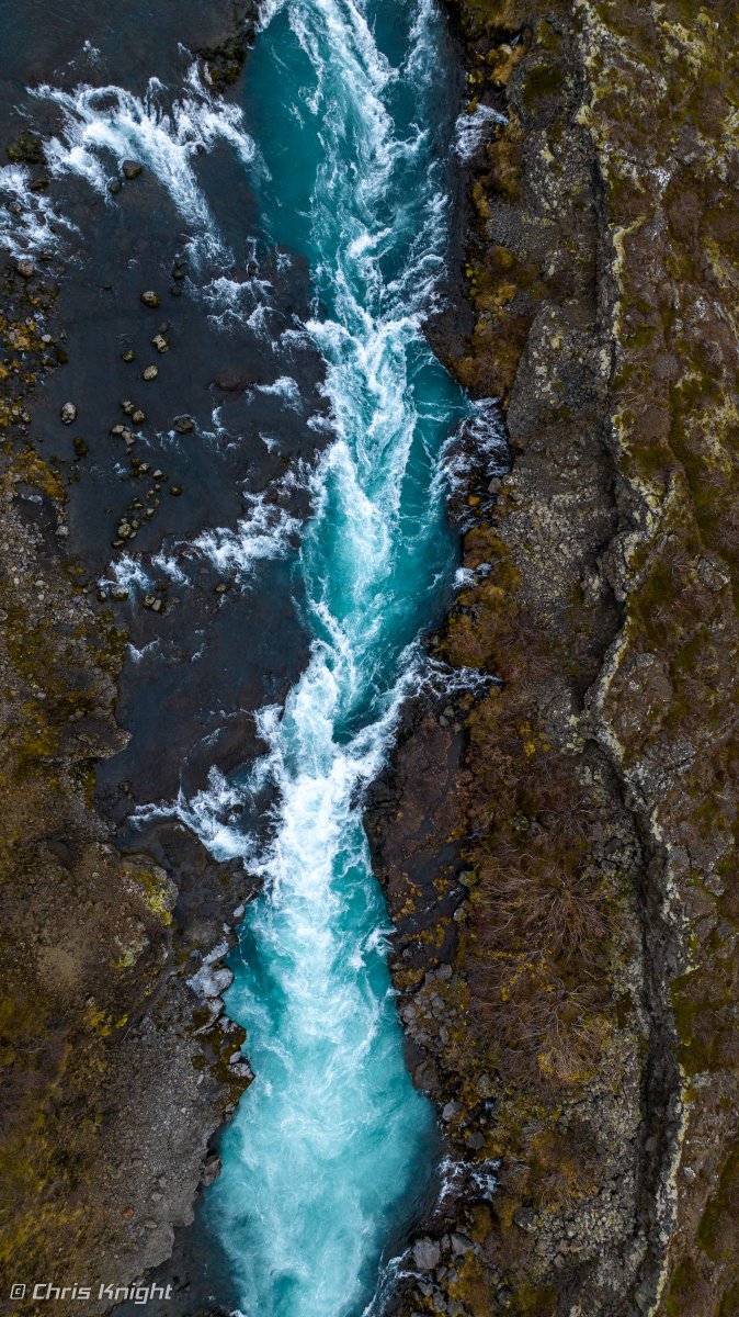 ChrisKnight's tweet photo. Top down view of the blue/green Barnafoss Waterfalls. There are two "Barnafoss" waterfalls in Iceland, this one is in Möðruvallavegur (near Húsafell) and the other is in the North/central region of Iceland. #GoChasingWaterfalls https://t.co/A9qAUlVr6l