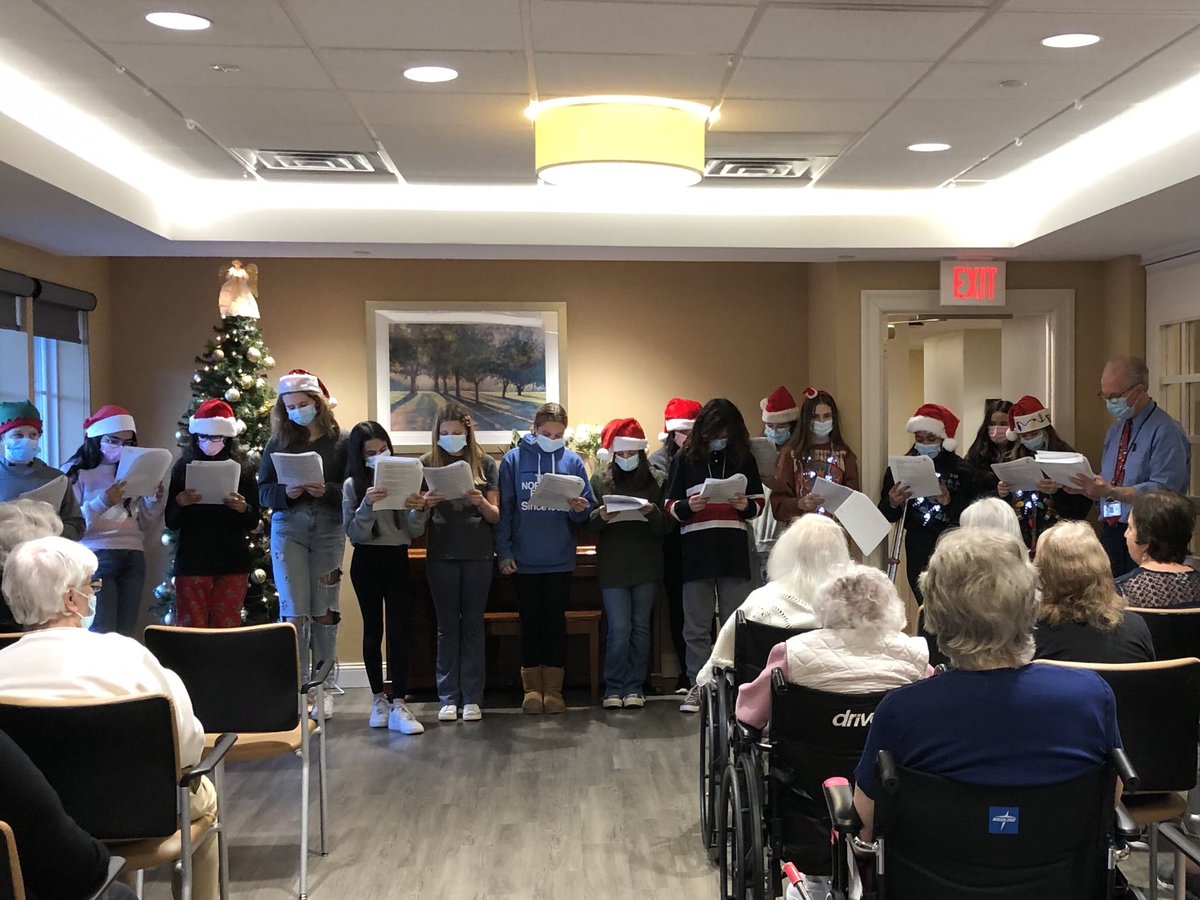 Eisenhower React caroling at Longview Courtyard at Christian Healthcare.  “Rockin around the Christmas tree”