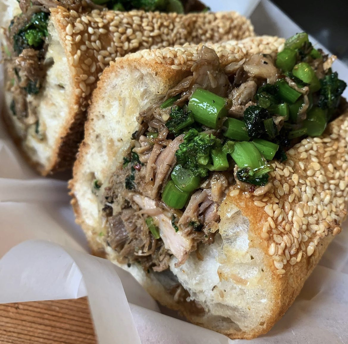 "THE ROAST PORK ITALIANO Our Italian style roast pork is garlic, chili and herb rubbed and roasted to perfection. Our pork is topped with sautéed broccoli rabe, aged sharp provolone and the cooking jus all nestled in our crusty, seeded, semolina roll. @ninth_and_fitzwater "