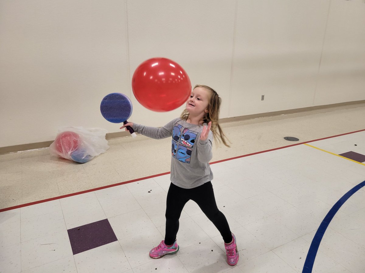 Some of our learning activities today included drawing and writing on holiday cards, pretending to wrap presents, giving each other sleigh rides, and tapping a balloon with a paddle.