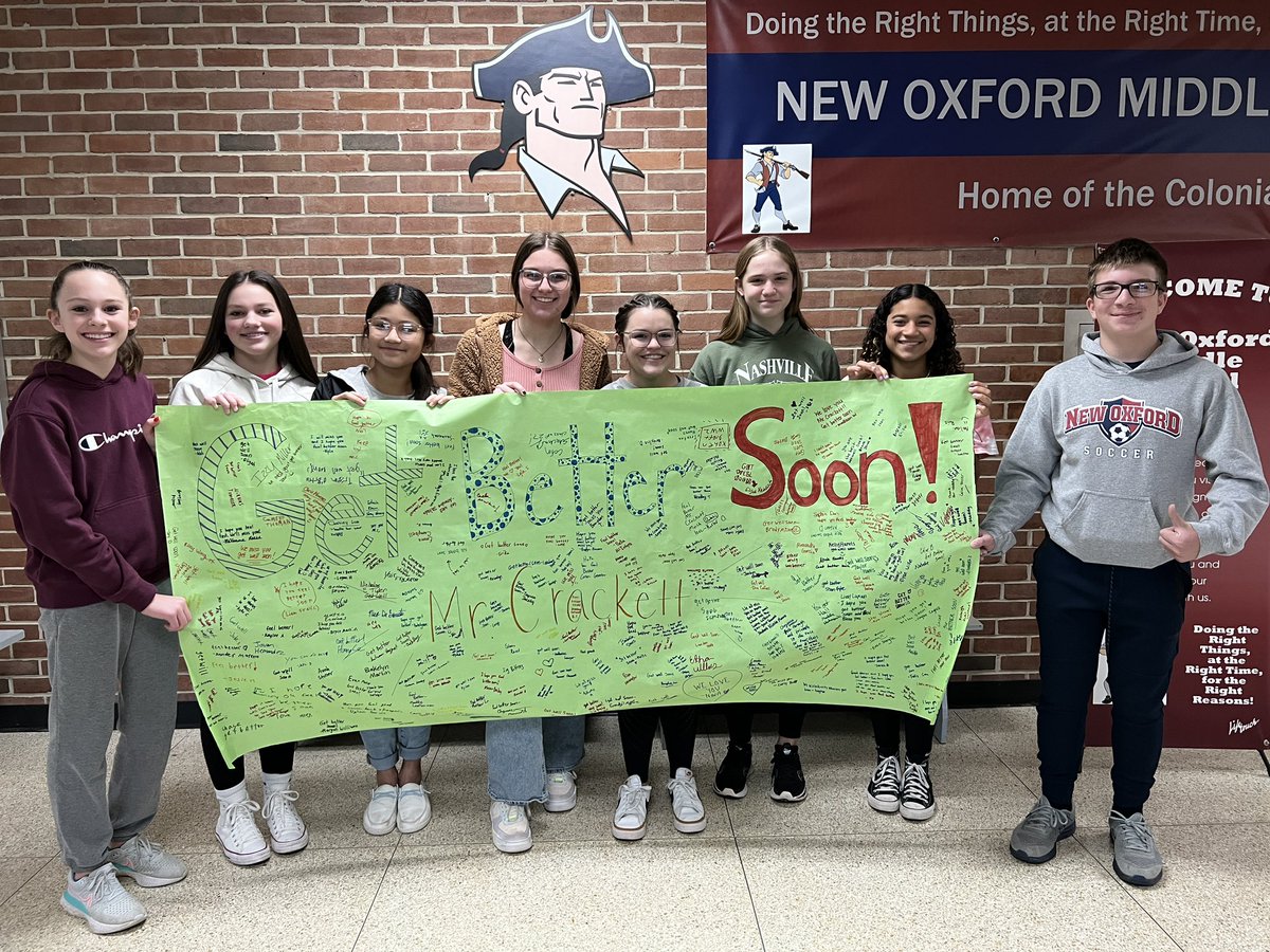 Relationships matter. Today a number of our students posed for a picture in support of one of our everyday substitutes. Many students signed the poster, offering kind words of support as he recovers from surgery.