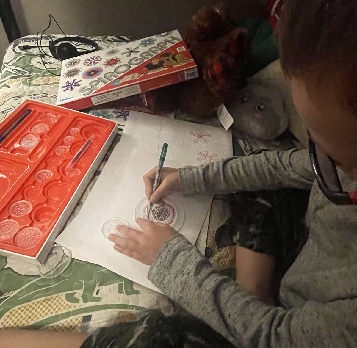 I went in to read his nightly book and tuck him in and found him hard at work with the #Spirograph…kids need more toys like this and less video games. #imaginationatwork