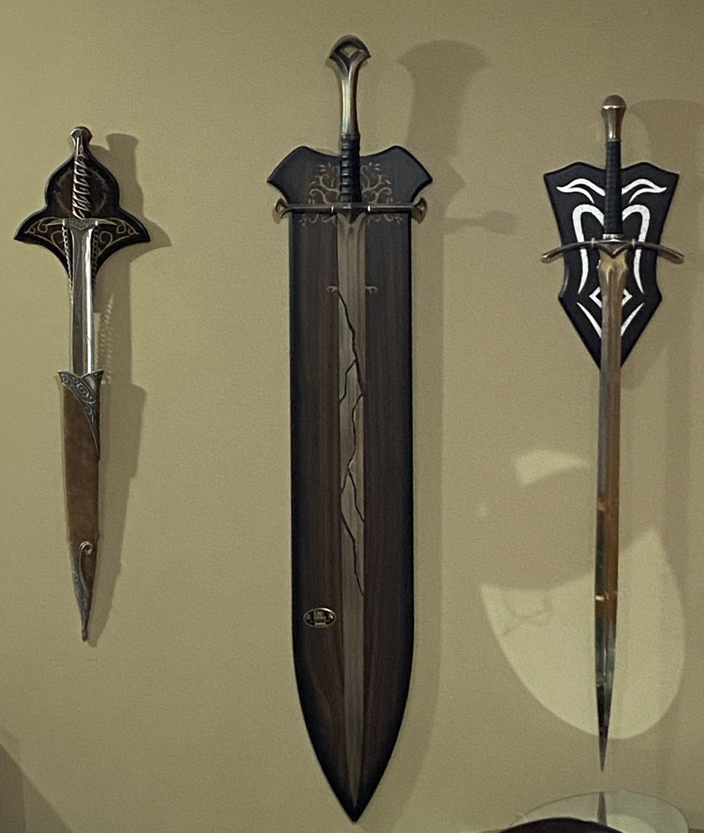 JimKLane's tweet photo. @LittleNommer That’s exactly how I felt about getting Glamdring to make this exact display.  The Shards were a Christmas present, Sting I wore at my wedding in 2007, and it took me until 2018 to get Glamdring, which has its own whole story. https://t.co/TmP03o0HWw